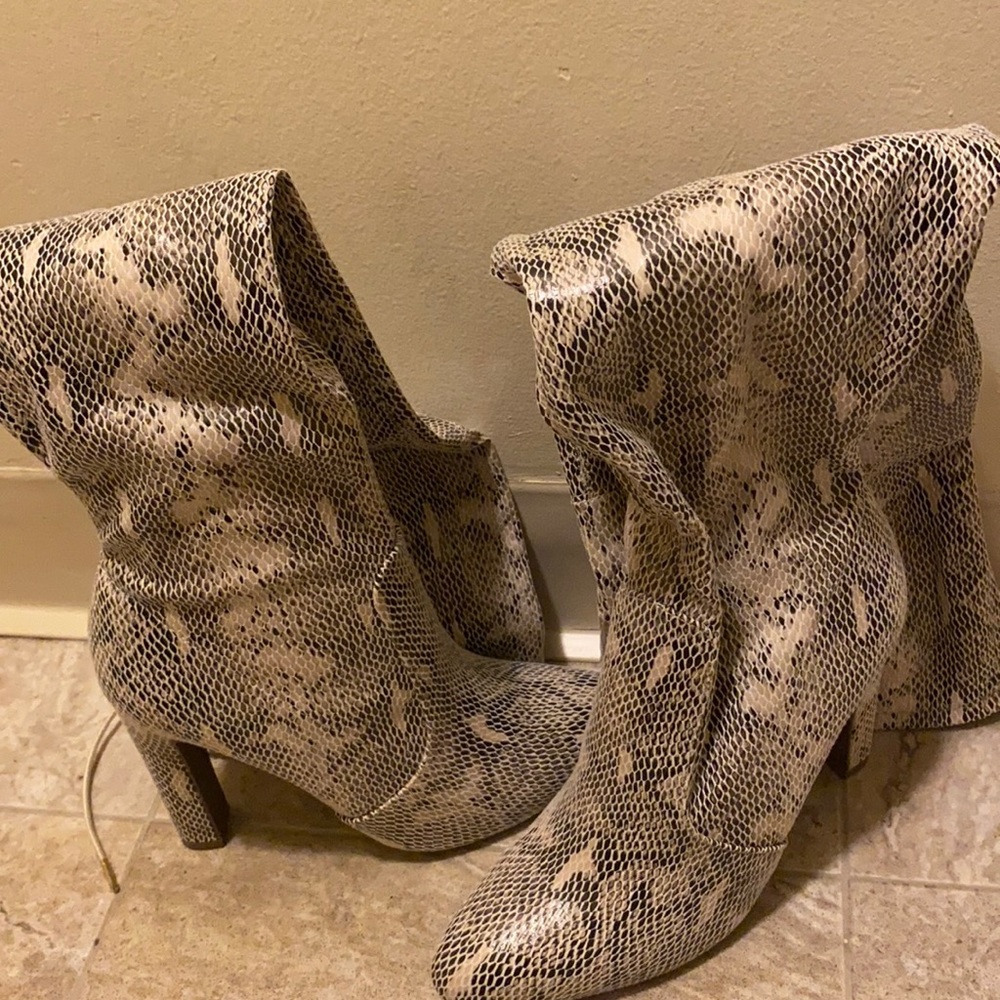 Over the knee Snake Print Boots.